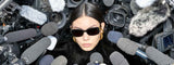 A pair of Balenciaga black BB0096S with a gold BB logo on the temples
